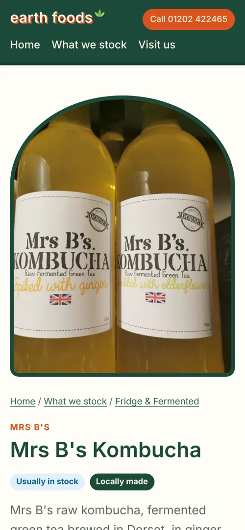 Earth Foods website on a phone, showing a product page for Mrs B's Kombucha